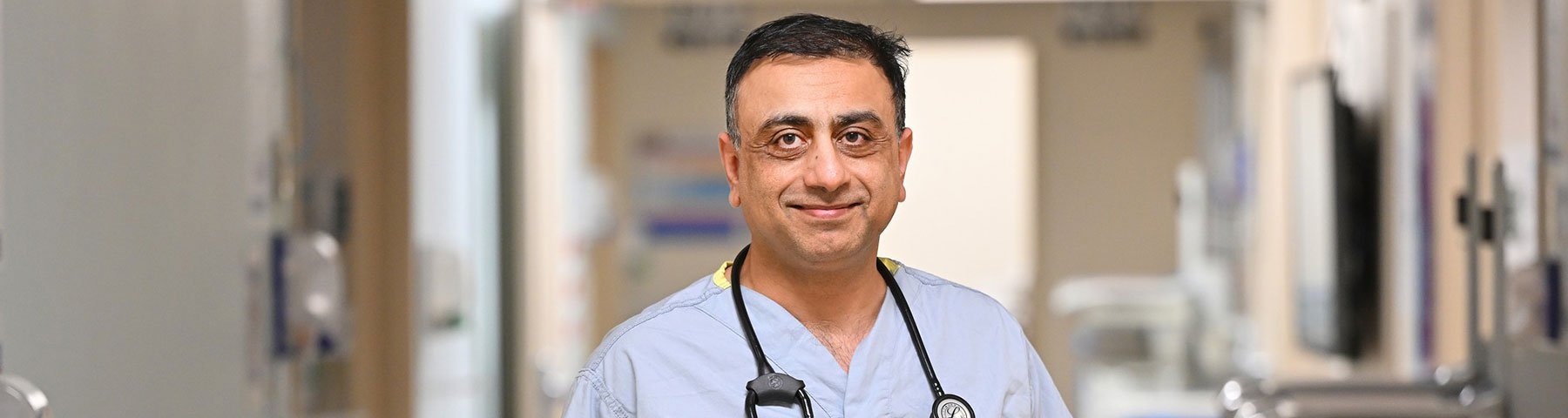 Dr. Philip Kuruvilla standing in hospital hallway