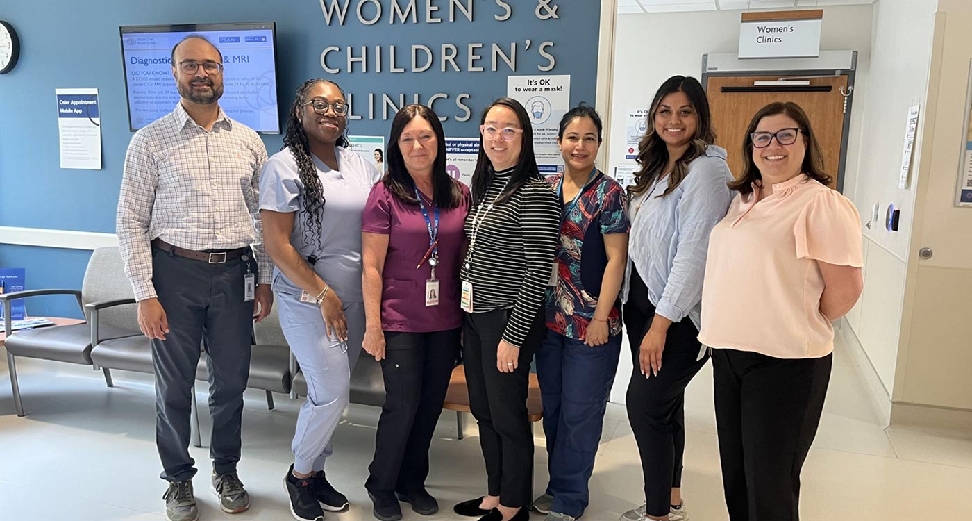Paediatric sickle cell clinic team poses in the Women's and Children's Department at Peel Memorial
